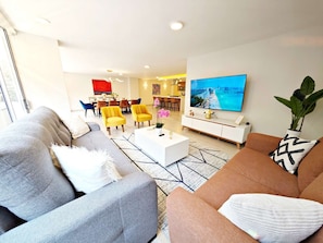 A modern living room with a sofa, coffee table, and a flat-screen TV. - Leonora 3 · 180 m² steps from Masaryk and Antara · 4 baths (Ciudad de México)