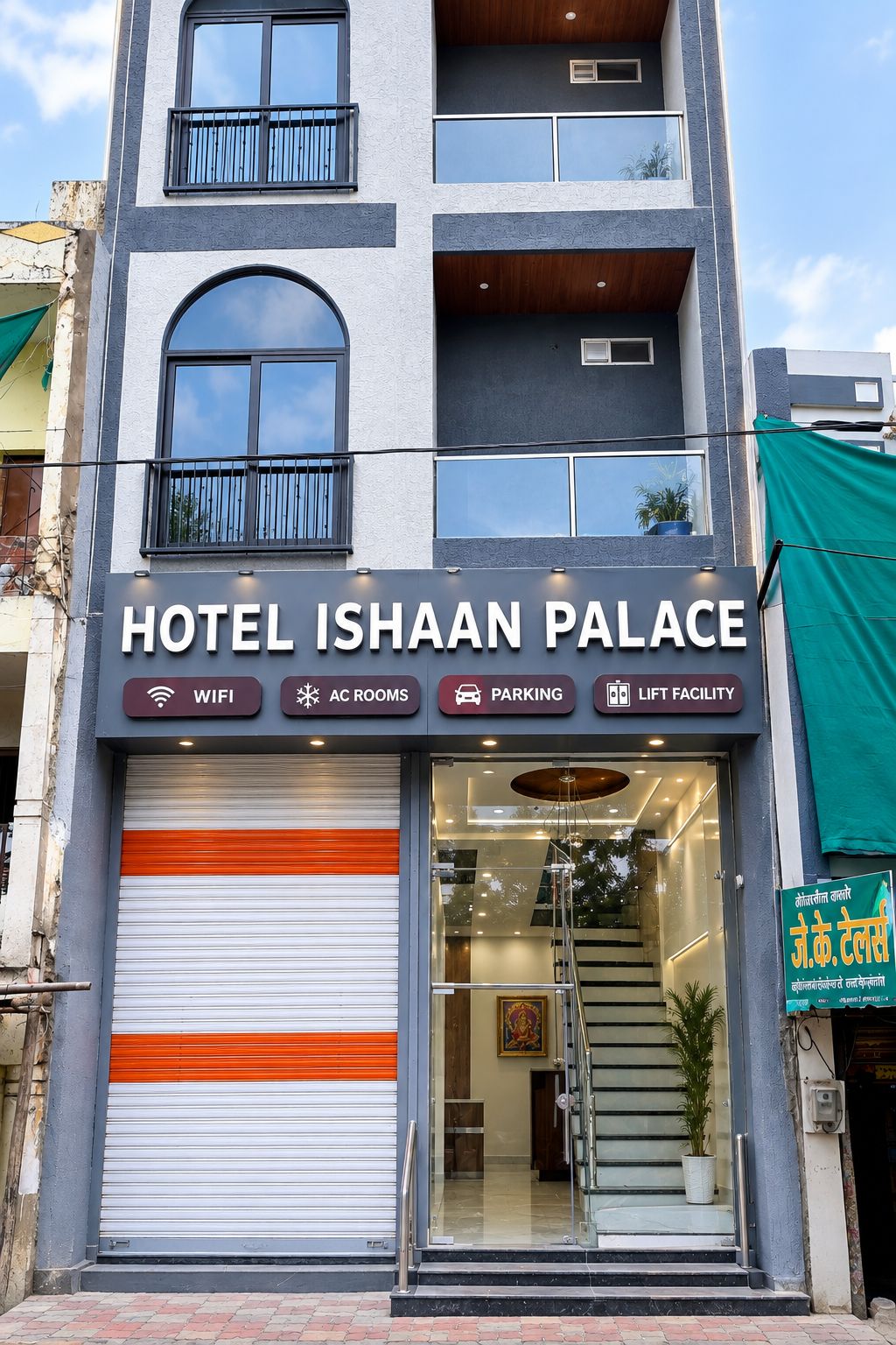 A hotel named 'Hotel Ishaan Palace' with a signboard indicating amenities like WIFI, AC rooms, parking, and lift facility.