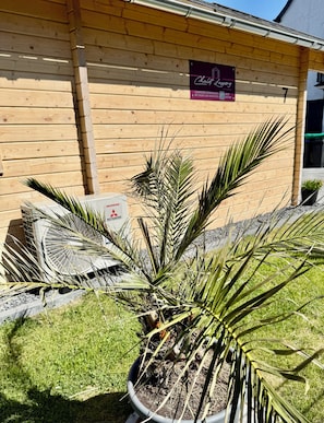 A wooden building with a sign that reads 'Chalet Luxury.'