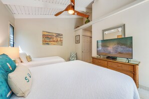 A bedroom with two beds, a ceiling fan, a painting, a television, and a dresser. - Ocean View Wailea 2bd I Wailea Ekolu 702 (Kihei)