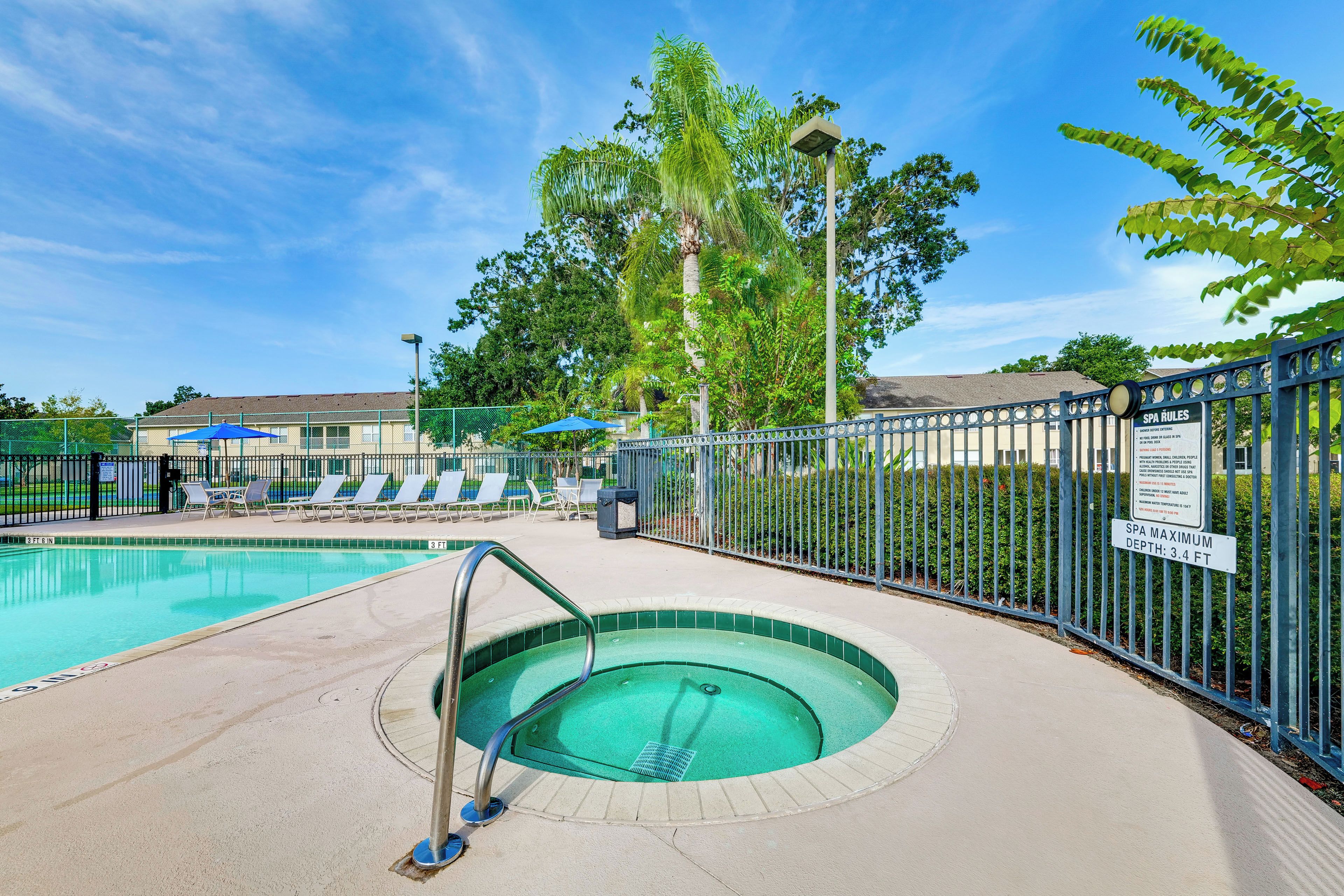 A swimming pool with a 3 ft 6 in depth and a 3 ft 4 in maximum depth sign.
