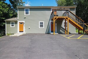A two-story building with a wooden staircase leading to a balcony. - Poconos Mtn Getaway: 4 Mi to Camelback Resort (Tannersville)