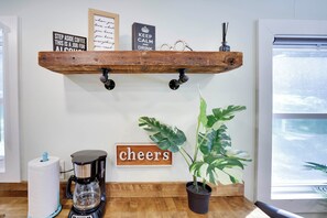 A kitchen counter with a coffee maker, a potted plant, and motivational signs. - Poconos Mtn Getaway: 4 Mi to Camelback Resort (Tannersville)