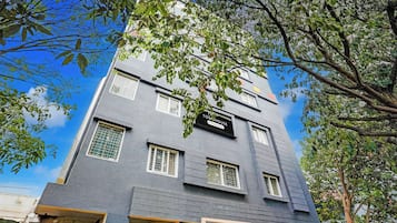 A multi-story building with a sign indicating it is a company-serviced warehouse.