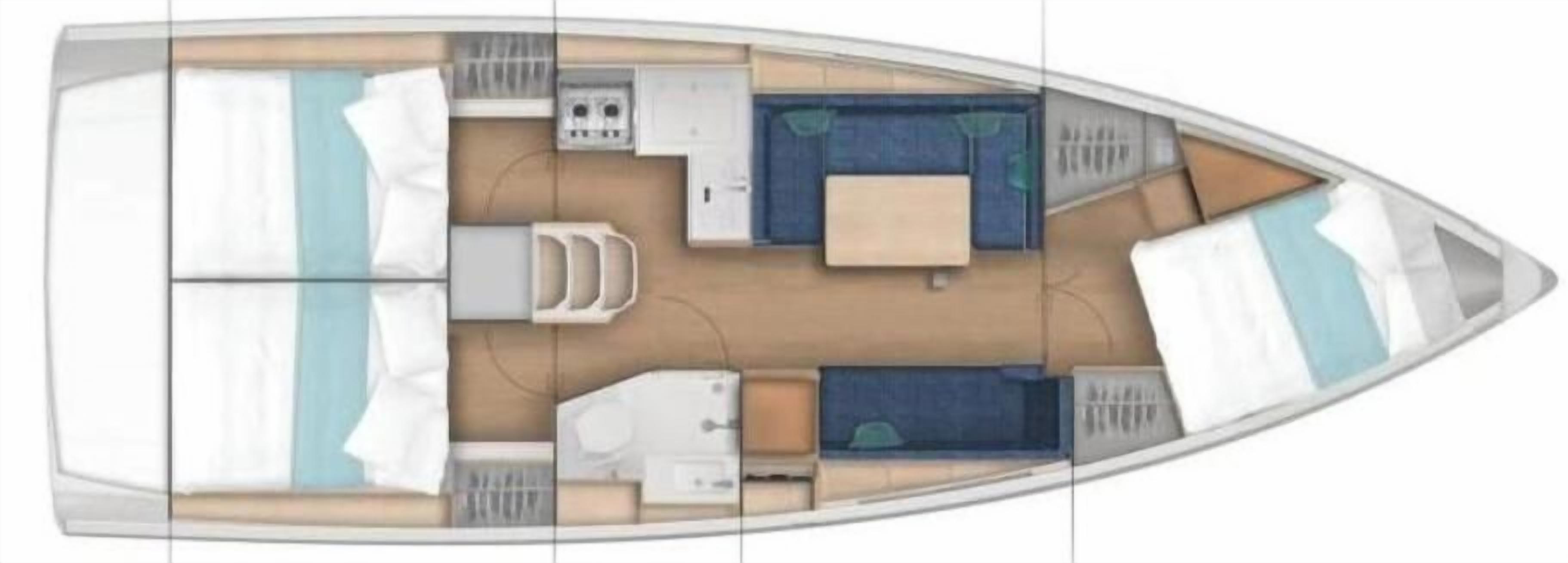 A boat interior with a bed, seating area, and a small kitchen.