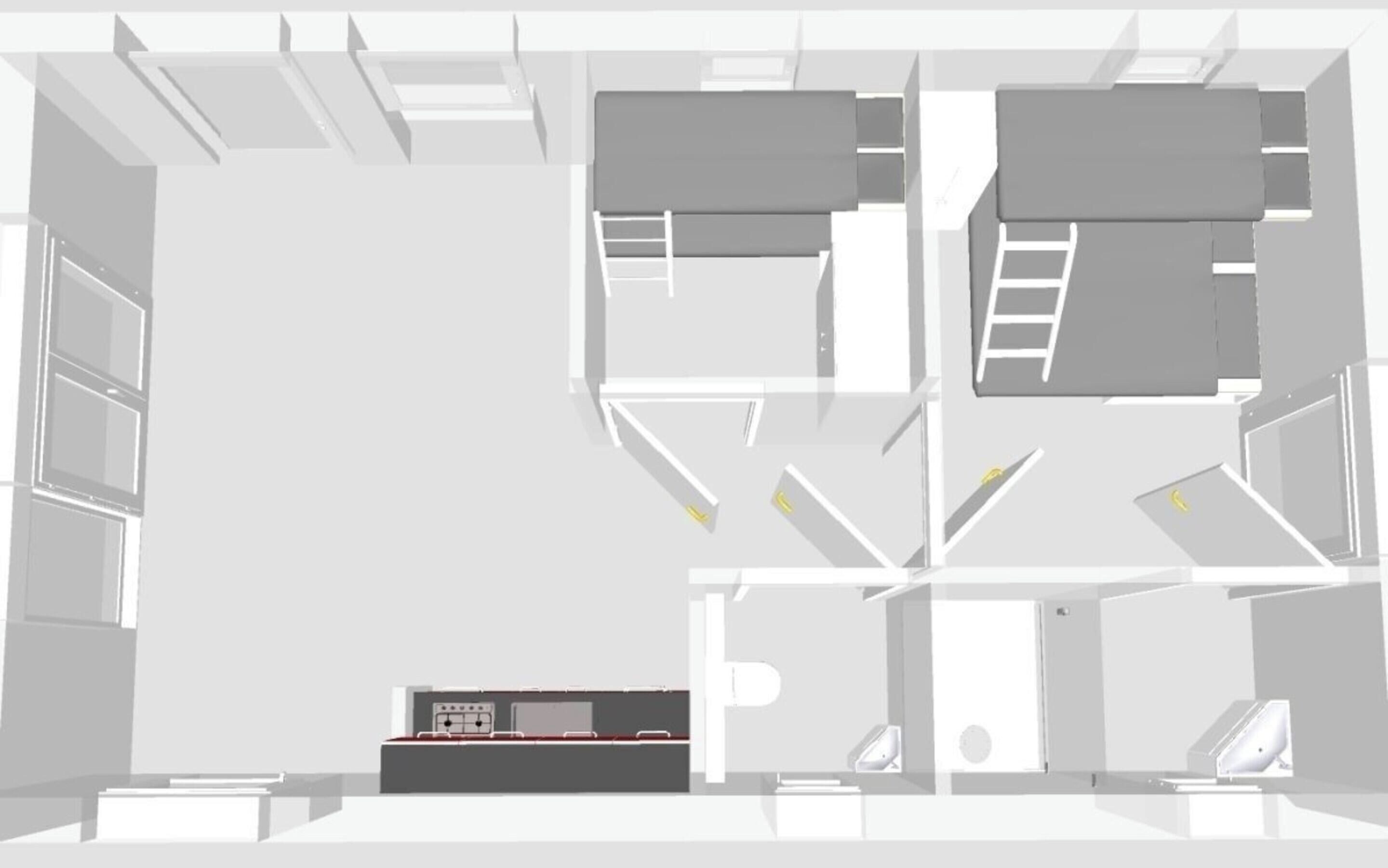 Grundriss eines Hotelzimmers mit Küchenzeile, einem Bett, einem Badezimmer und einer Sitzecke.