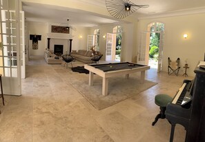 A spacious living area with a pool table, a sofa set, a fireplace, and a grand piano. - Villa Médicis – Sleeps 10, Private Pool, A/C & Walking Distance to the Sea (Le Pradet)