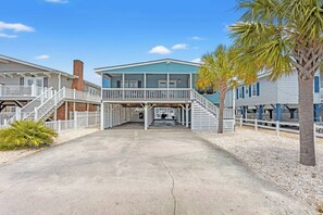 A beachfront property with a central building, two side wings, and a covered walkway. - Permission To Board- Dog Friendly on the Channel-Hot Tub (North Myrtle Beach)