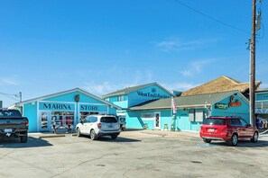 A marina with a store and a restaurant. - Private Canal Home w/ Boat Dock & Slip, Pool Table, Open Deck (Galveston)