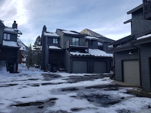 A residential area with houses, a driveway, and a garage. - Mt Royal above back deck, Main street and Summit Stage 2 blocks (Frisco)