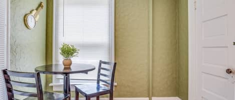Charming sunlit breakfast nook with cozy seating for two