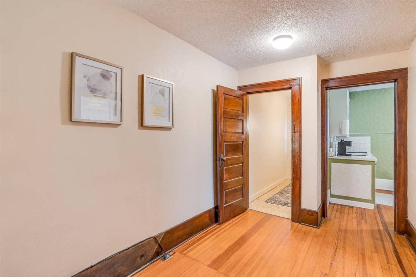 Charming hallway with hardwood floors and classic woodwork
