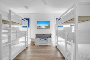 A room with bunk beds, a desk, and a window with a beach view. - Good Day Sunshine by Stay on 30a (Seacrest Beach)