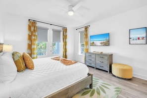 A bedroom with a bed, a dresser, a television, and a window with curtains. - Good Day Sunshine by Stay on 30a (Seacrest Beach)