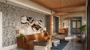 A modern living room with a textured wall, a sofa, a coffee table, and a large decorative piece. - Sabal House (Savannah)