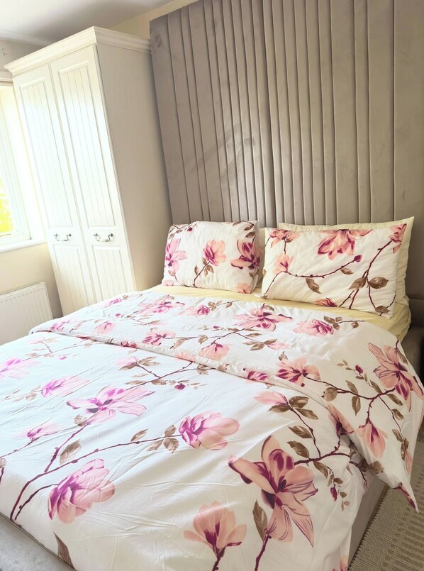 A bedroom with a bed, a headboard, and a wardrobe. - More Photos to Come in few Weeks (Norwich)
