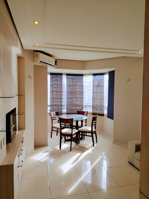 Gather for sunny meals beside wide windows and city views.