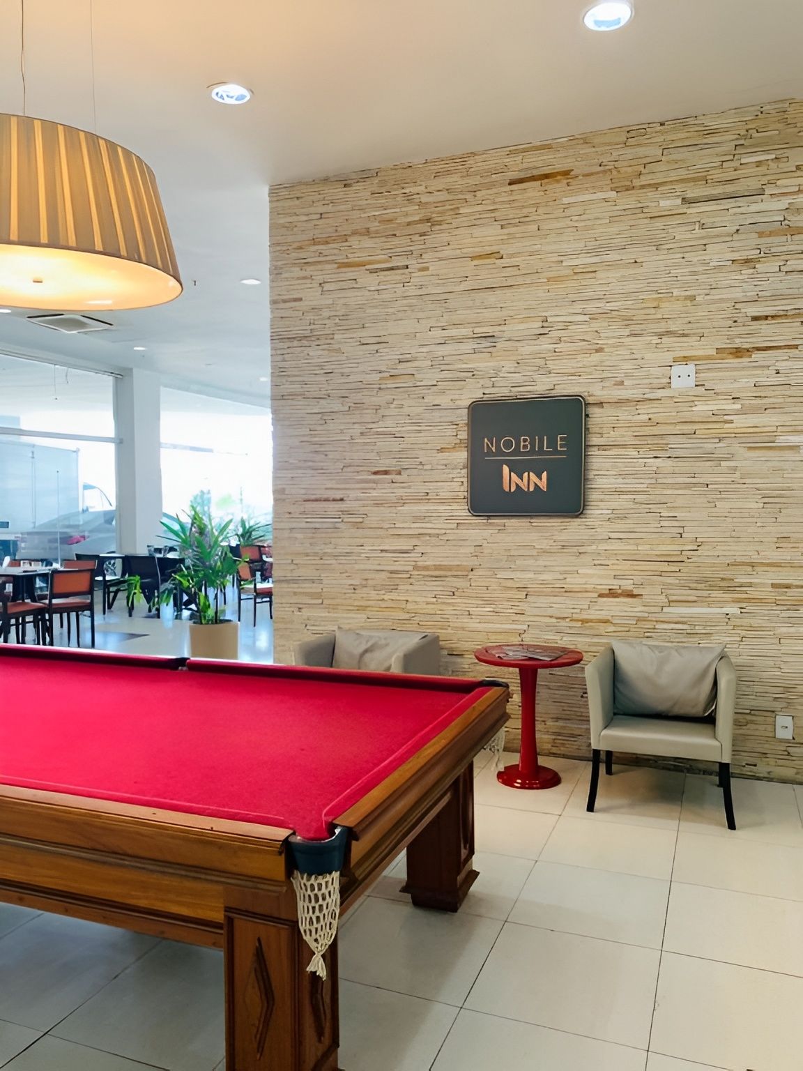 Challenge friends to a quick game beside the cozy lounge.