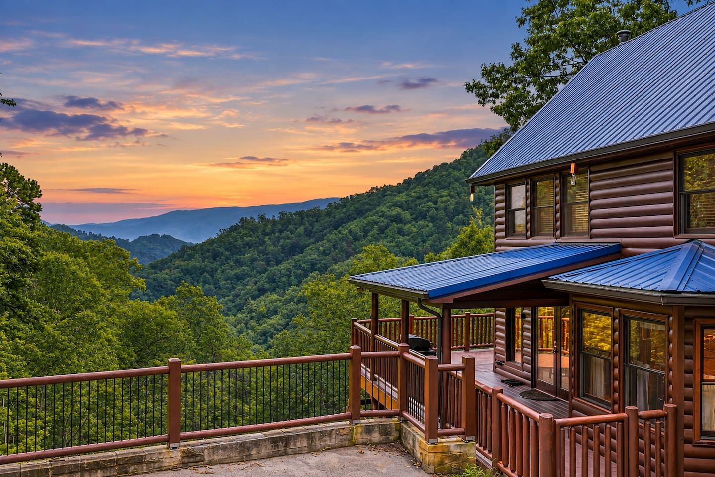 A log cabin with a balcony overlooking a forested valley.