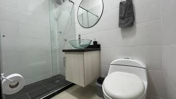 Bidet, towels, soap, toilet paper