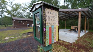 A book-themed outdoor display with a sign stating 'A book is a dream you can hold in your hands.'