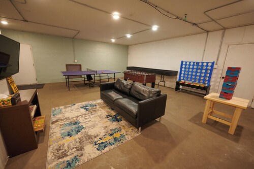 Near Dtwn Pella - Riverfront Property with Game Room, Fire Pit, and Yard Games
