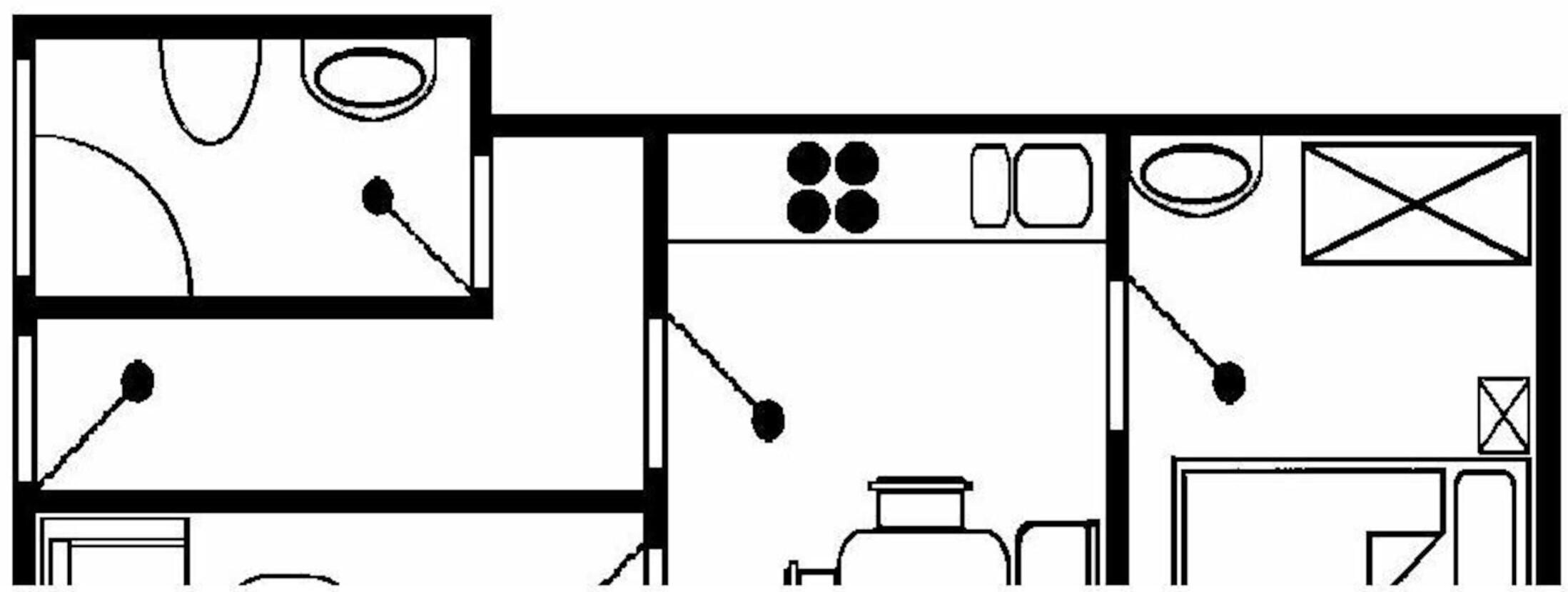 Indeling van een hotelkamer met een bed, bureau en zithoek.