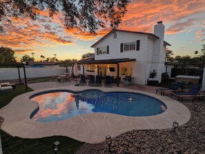 A house with a swimming pool, outdoor furniture, and a patio area. - Pool, Spa, & Games - Luxury Scottsdale Retreat Near Kierland (Scottsdale)