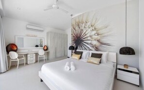 A modern bedroom with a large bed, a desk, and a chair. - Villa Ava Infinity Pool & Panoramic Sea Views (Bo Put)
