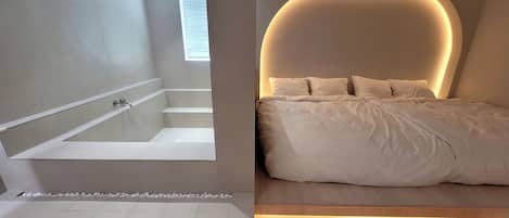 A modern bathroom with a bathtub, a shower, and a window.