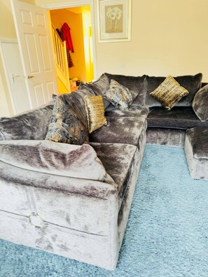 A living room with a grey sofa set, a blue carpet, and a framed picture on the wall. - More photos to come in few weeks (Reedham)
