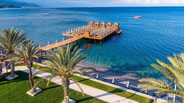 A coastal resort with a pier extending into the sea, offering beach access and a view of the ocean. - Hydros Beach Resort (Kemer)