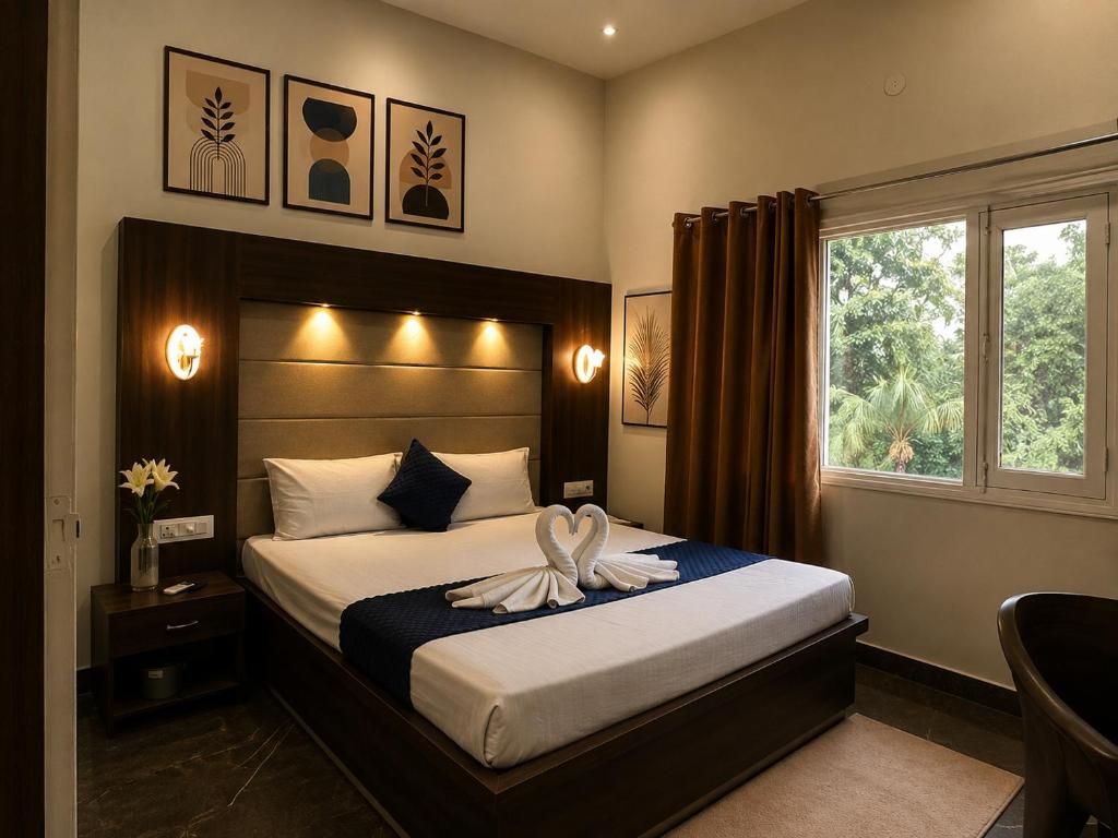 Habitación de hotel con una cama grande, una mesita de noche con un jarrón de flores y vistas al verdor por la ventana.