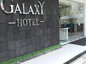 A hotel entrance with a dark facade and a sign that reads 'GALAXY HOTEL'. - Galaxy Hotel (Tarakan)
