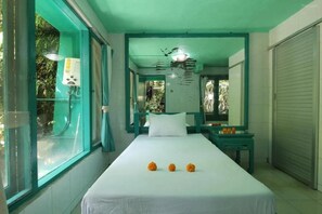 A single-bed room with a large window, a bedside table, and a mirror. - Belvilla Padma Legian Resort Near Monkey Forestnearubud Palace (Ubud)