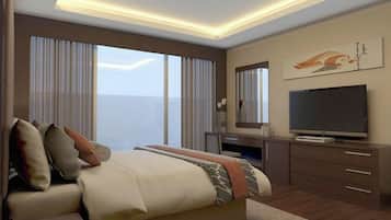 A hotel room with a bed, a desk, a television, and a large window.