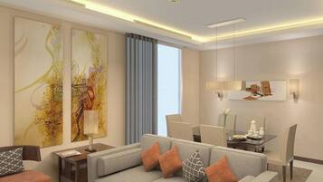 A modern living room with a sofa, a coffee table, and a dining area with chairs and a table. There are abstract paintings on the walls and a window with curtains.
