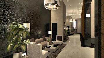 A modern interior with a reception area, seating, and a plant.
