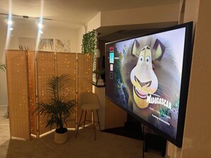 A television displaying 'Madagascar' with a menu bar on the left. - Luxe & Modern 1-bed with panel living space w Pool, Hot tub, Gym -Marina del Rey (Marina del Rey)