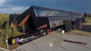 A modern library building with a unique angular design, large windows, and a sign indicating it is the Edmonton Public Library. - Mod Artist Loft | Near University | 10 min to DT (Edmonton)