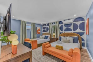 A modern hotel room with two beds, a desk, and a TV. - Sauna Hot Tub Game Room Theater Firepit (Bethel)