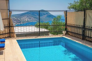 A swimming pool with a view of a mountain and a body of water. - Villa With Stunning sea View and Private Pool (Kaş)