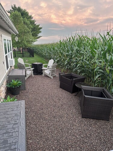 Charming recreational vehicle with a cozy sitting area, fire pit and a 65” tv.