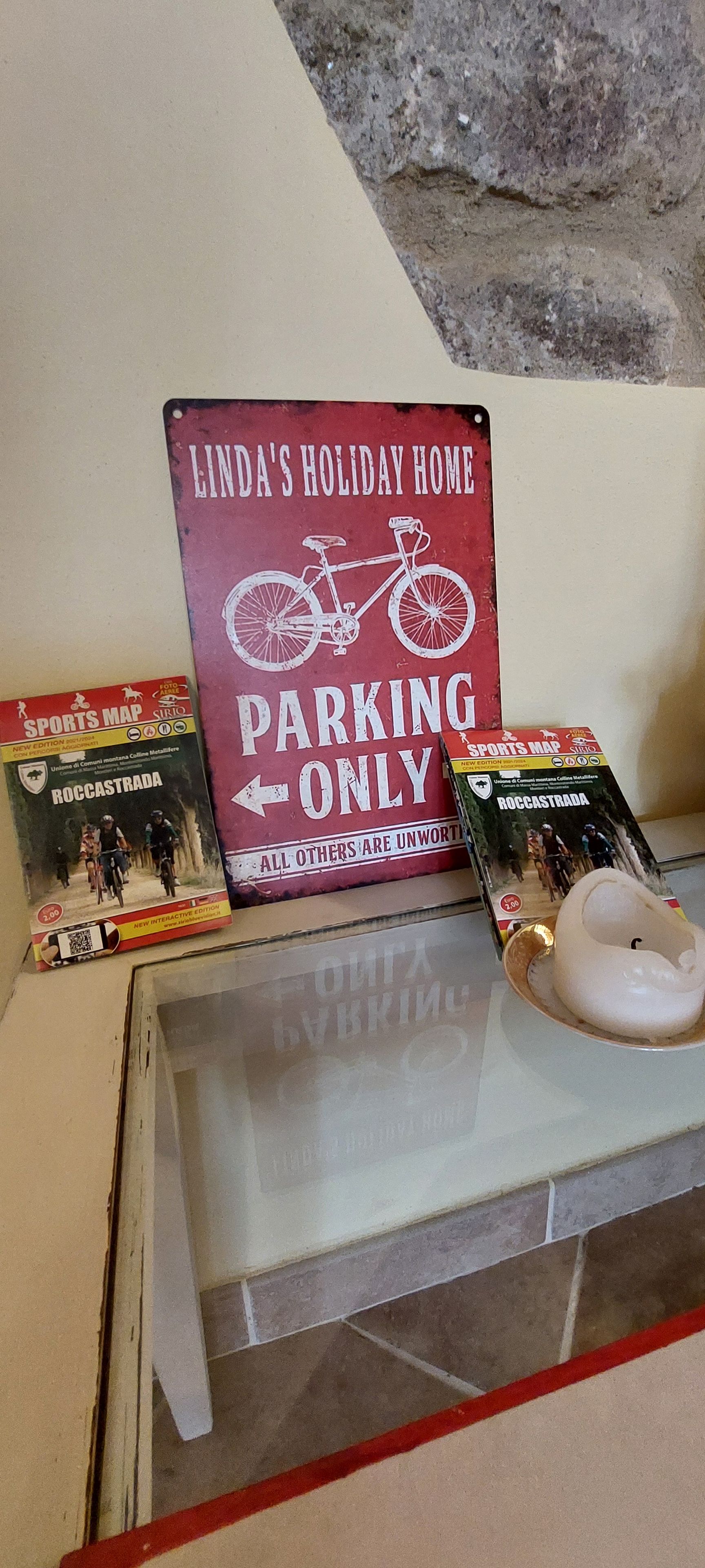 A sign indicating parking is reserved for bicycles only, with a bicycle illustration and text.