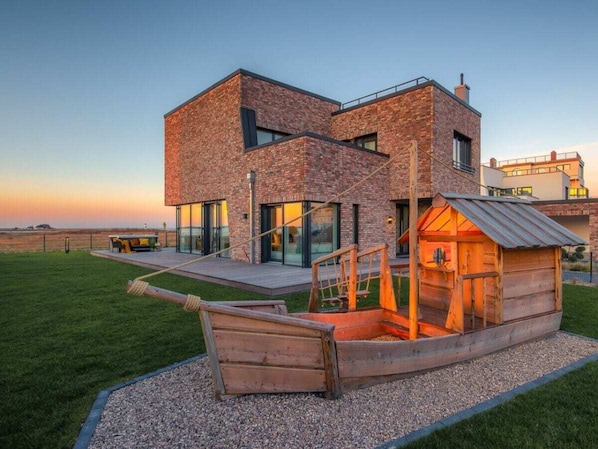 A modern two-story house with a brick exterior and large windows. - Villa in Kappeln With Swimming Pool (Kappeln)