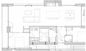 A floor plan with a central living area, a kitchen, two bedrooms, and a bathroom. - Home Port 1st Floor (Kappeln)
