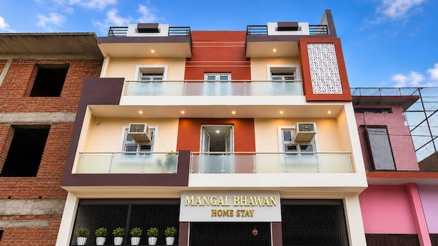 A two-story building with a sign reading 'Mangal Bhawan Home Stay'. - Classic Ayodhya Junction Road (Faizabad)