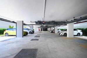 A multi-level parking garage with several cars parked. - Kamala - Jungle View for Families (Tambon Kamala)