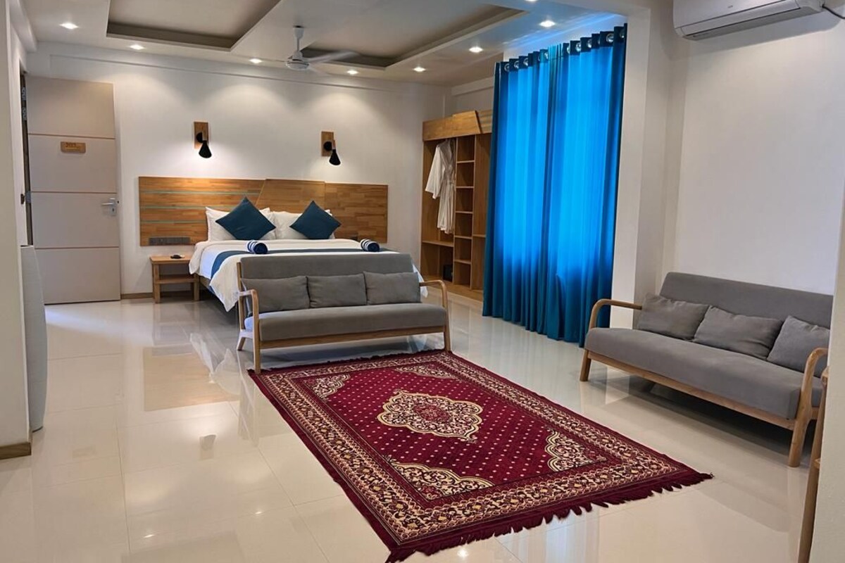 Family Suite, City View | Minibar, in-room safe, blackout curtains, iron/ironing board
