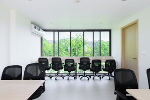A conference room with a long table and six black office chairs. - Kamala - Peaceful Jungle View (Tambon Kamala)